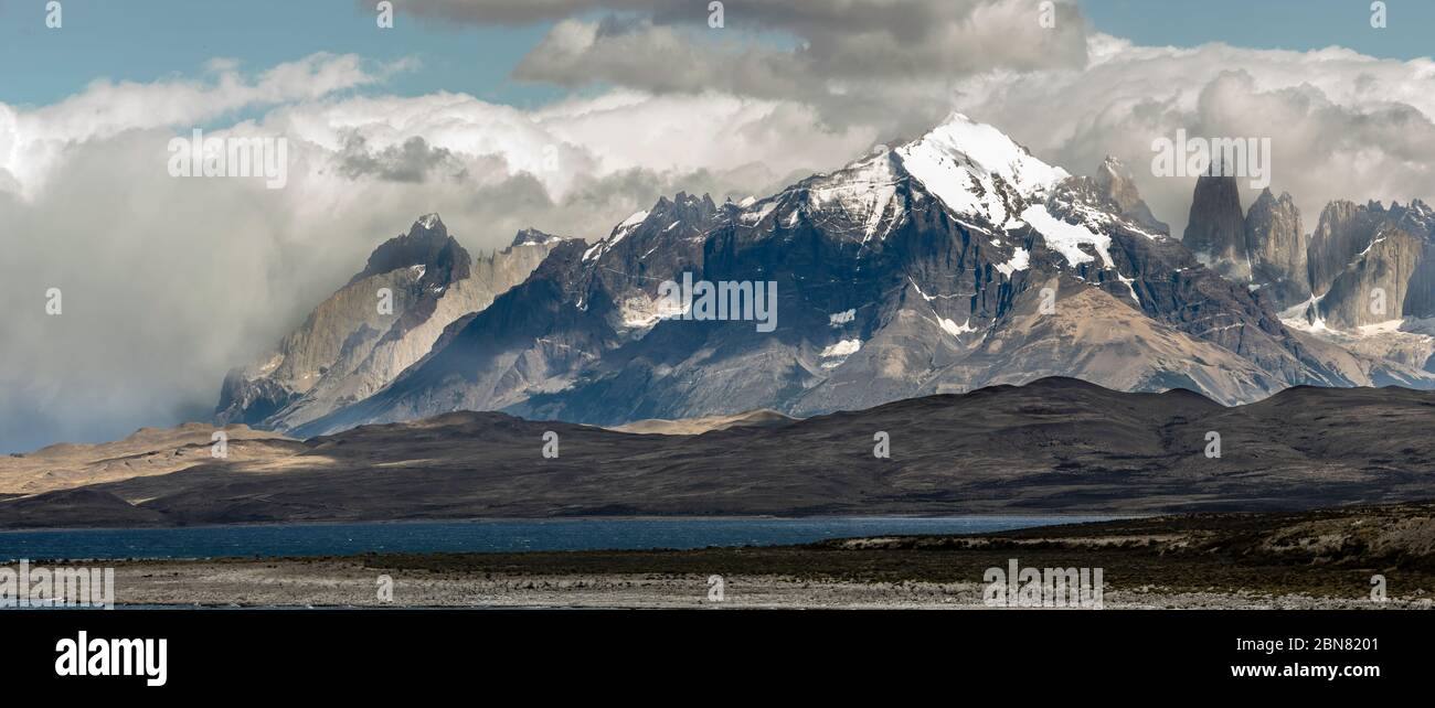 The Cordillera Paine mountain range with the three Torres del Paine. (North, or Torres Monzino, tower to the right.) Stock Photo