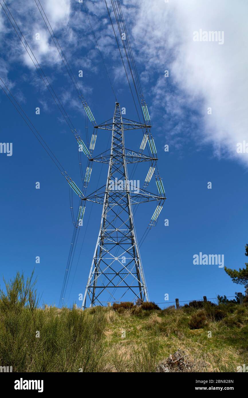 A transmission tower or power tower, electricity pylon or variations is a tall structure, usually a steel lattice tower used to support an overhead po Stock Photo