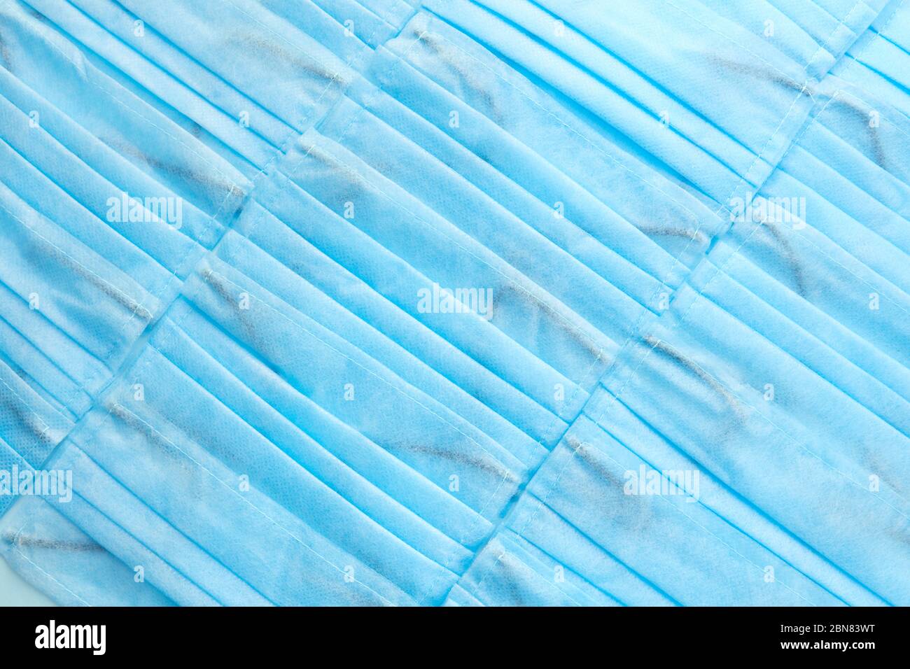 Medical masks diagonally arranged as a background. Top view Stock Photo ...