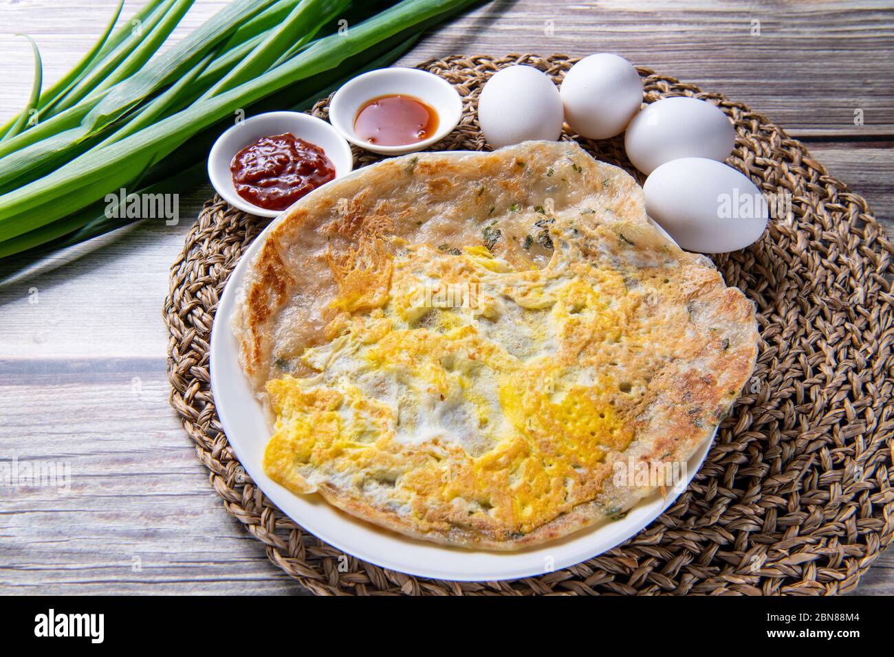 scallion pancake, is a Chinese, savory, unleavened flatbread folded