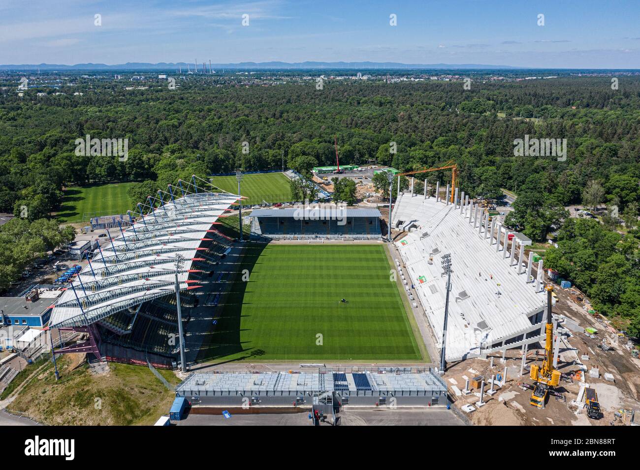 Karlsruhe, Deutschland. 12th May, 2020. Stadium overview Wildparkstadion. The versus straight (right) is currently being built. View of the pitch and the field on which a second division game is to take place next Saturday as a ghost game. Drone shot of construction site at Wildparkstadion Karlsruhe. GES/Football/2nd Bundesliga Karlsruher SC Wildpark Stadium, May 12, 2020 Football/Soccer: 2nd German Bundesliga: Karlsruher SC Stadium, Karlsruhe, May 12, 2020 Drone view over KSC-Wildpark Stadium under construction. | usage worldwide Credit: dpa/Alamy Live News Stock Photo