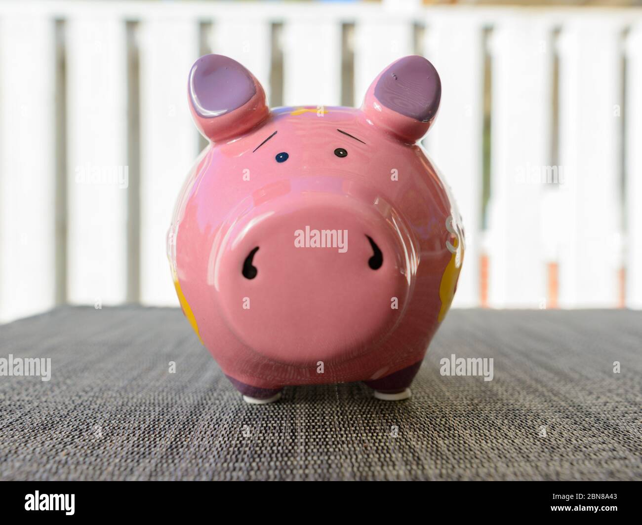 Piggy bank waiting for money investment and wealth outdoors Stock Photo