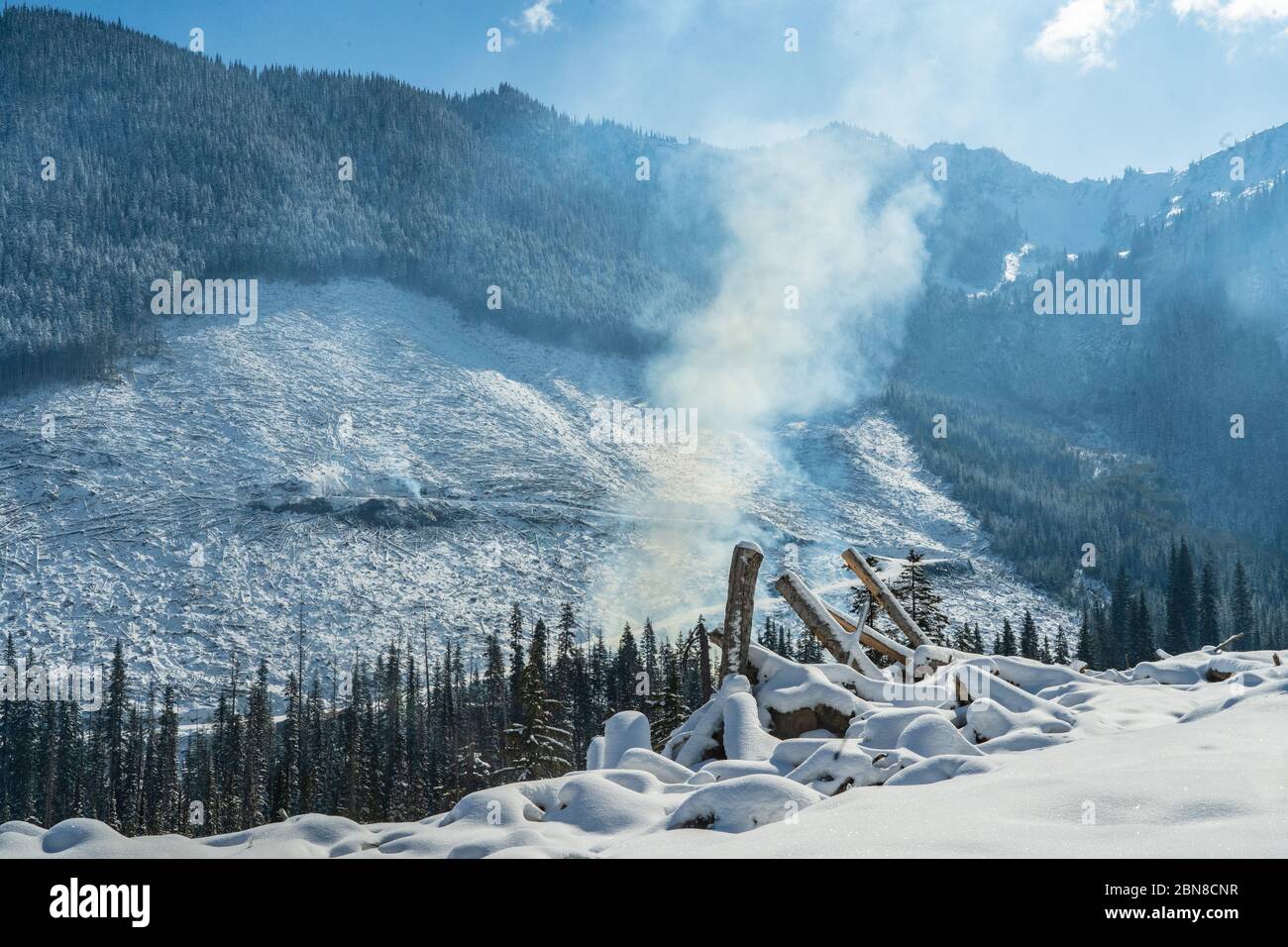 Slash piles burning in the headwaters of the Skagit River,. Stock Photo