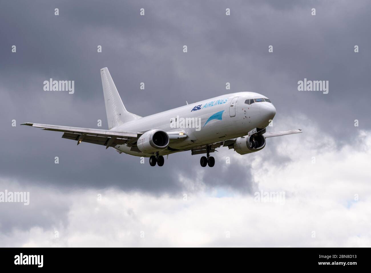 ASL Airlines Boeing 737 EI-STJ cargo jet plane arriving with freight for an Amazon warehouse landing at London Southend Airport UK in bad weather Stock Photo
