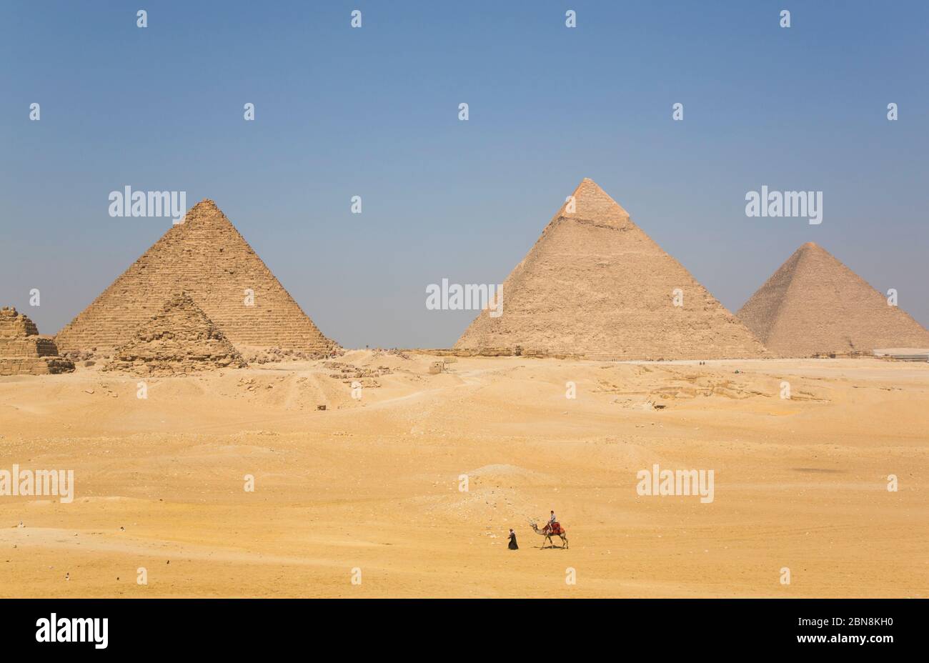 Tourist Riding a Camel, Great Pyramids of Giza, UNESCO World Heritage Site, Giza, Egypt Stock Photo