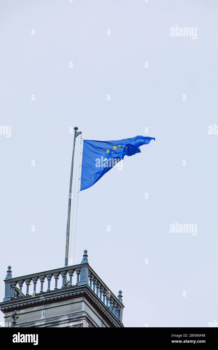 european union flag in front of blue sky Stock Photo - Alamy