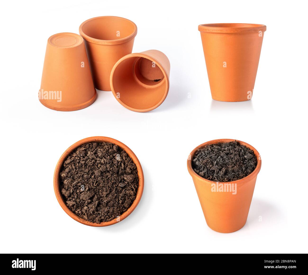 clay pot filled with organic potting soil on a white background Stock Photo