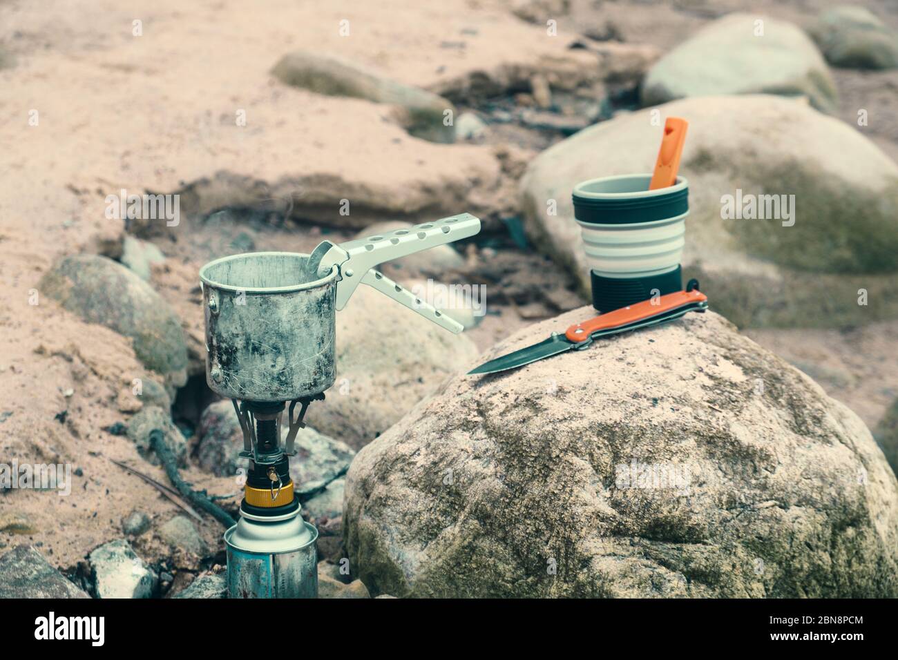 Cooking while hiking with a backpack Stock Photo - Alamy