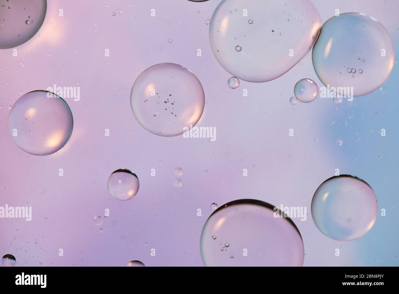 Defocused pastel colored abstract background picture made with oil, water and soap Stock Photo