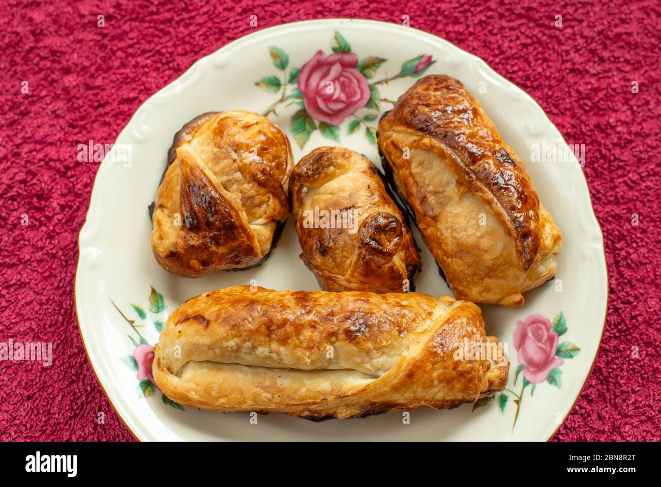 Four nicely browned homemade pastries (pains au chocolat) Stock Photo