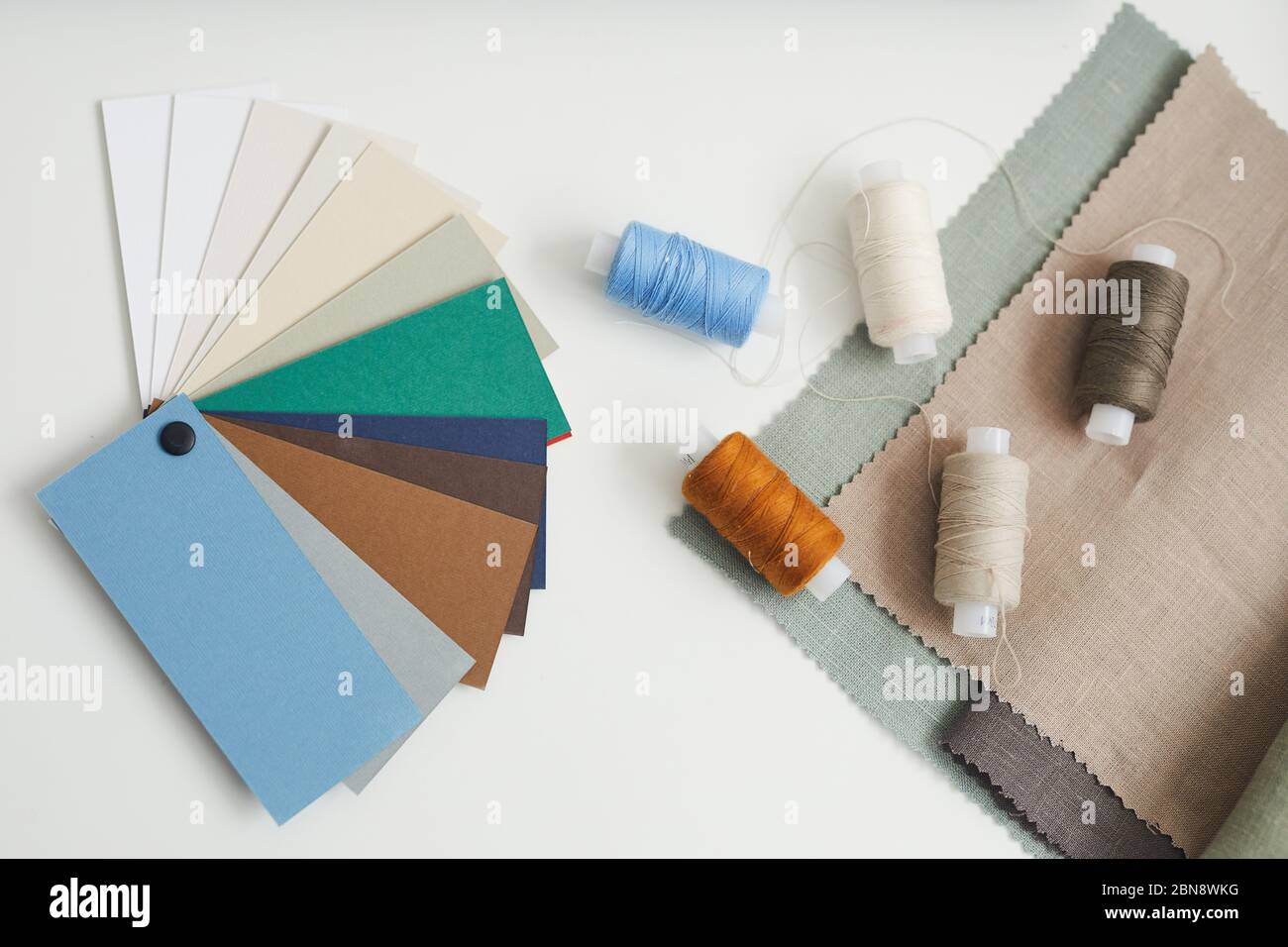 High angle view of colored pattern and threads lying on the table for tailoring Stock Photo