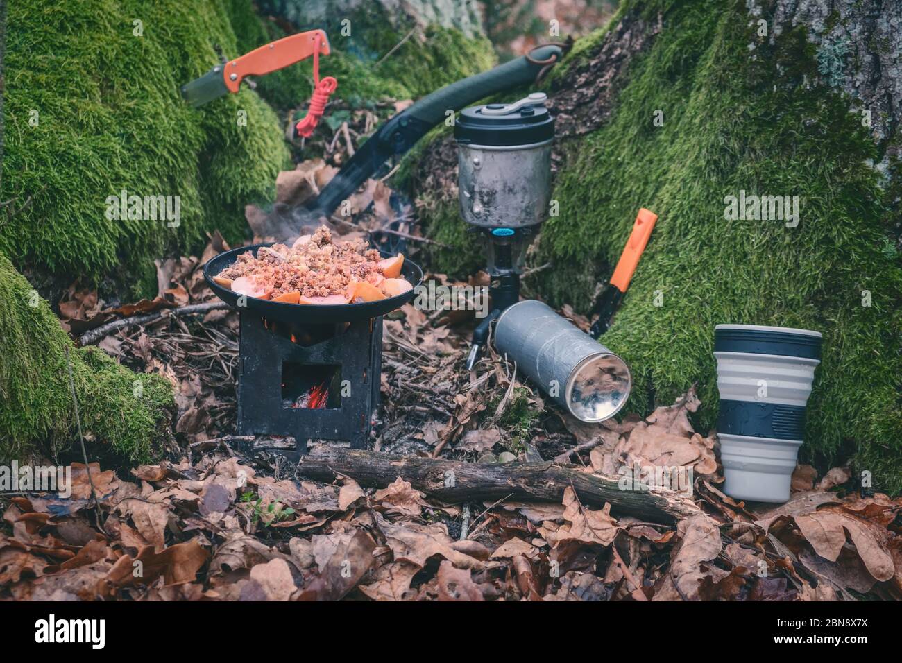Cooking while hiking with a backpack Stock Photo - Alamy