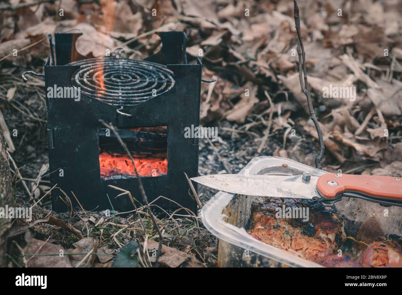 Cooking while hiking with a backpack Stock Photo - Alamy