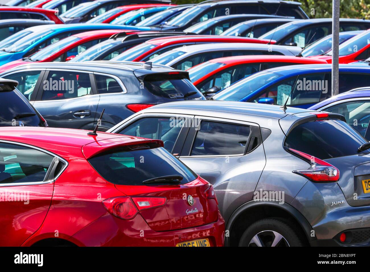 Secondhand cars for sale on forecourt hires stock photography and