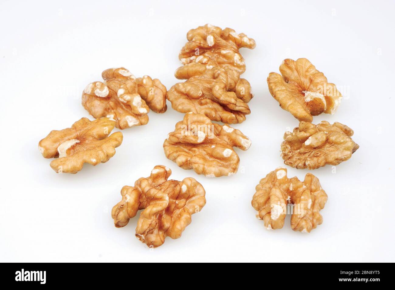 Useful organic walnuts, close-up, isolated on white background. Stock Photo