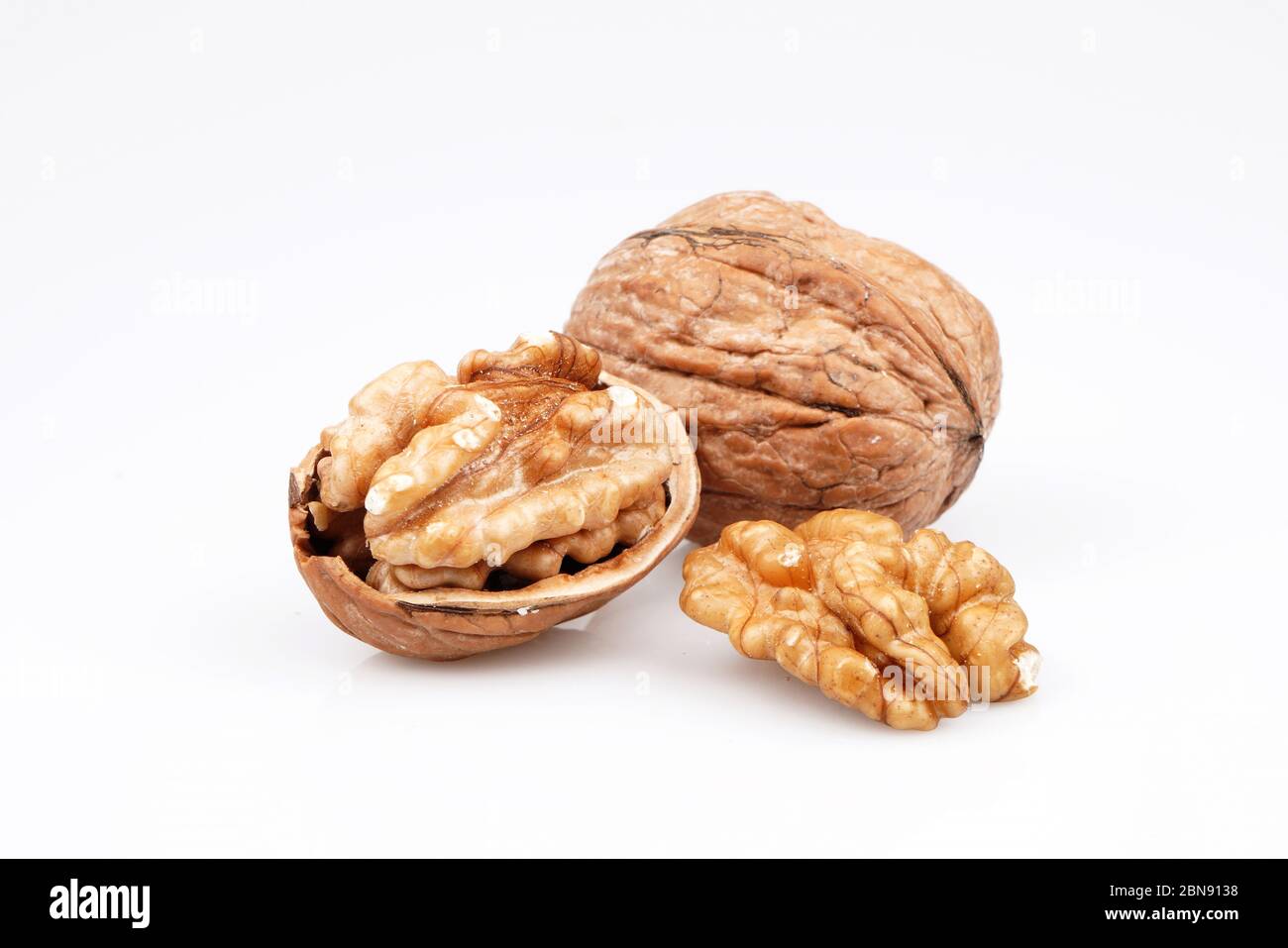 Organic Delicious walnuts, isolated on white background Stock Photo