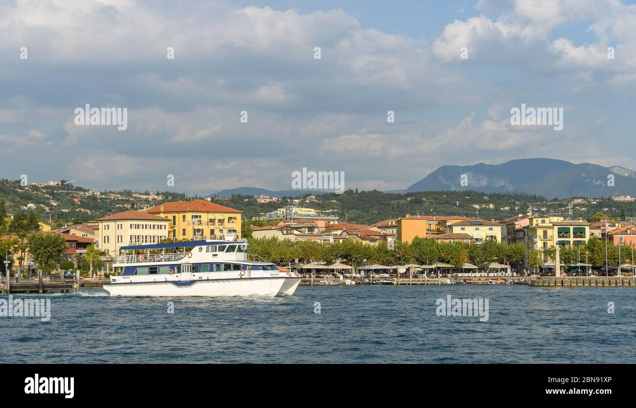 GARDA, ITALY - SEPTEMBER 2018: Small ferry departing the town of Garda on Lake Garda. Stock Photo