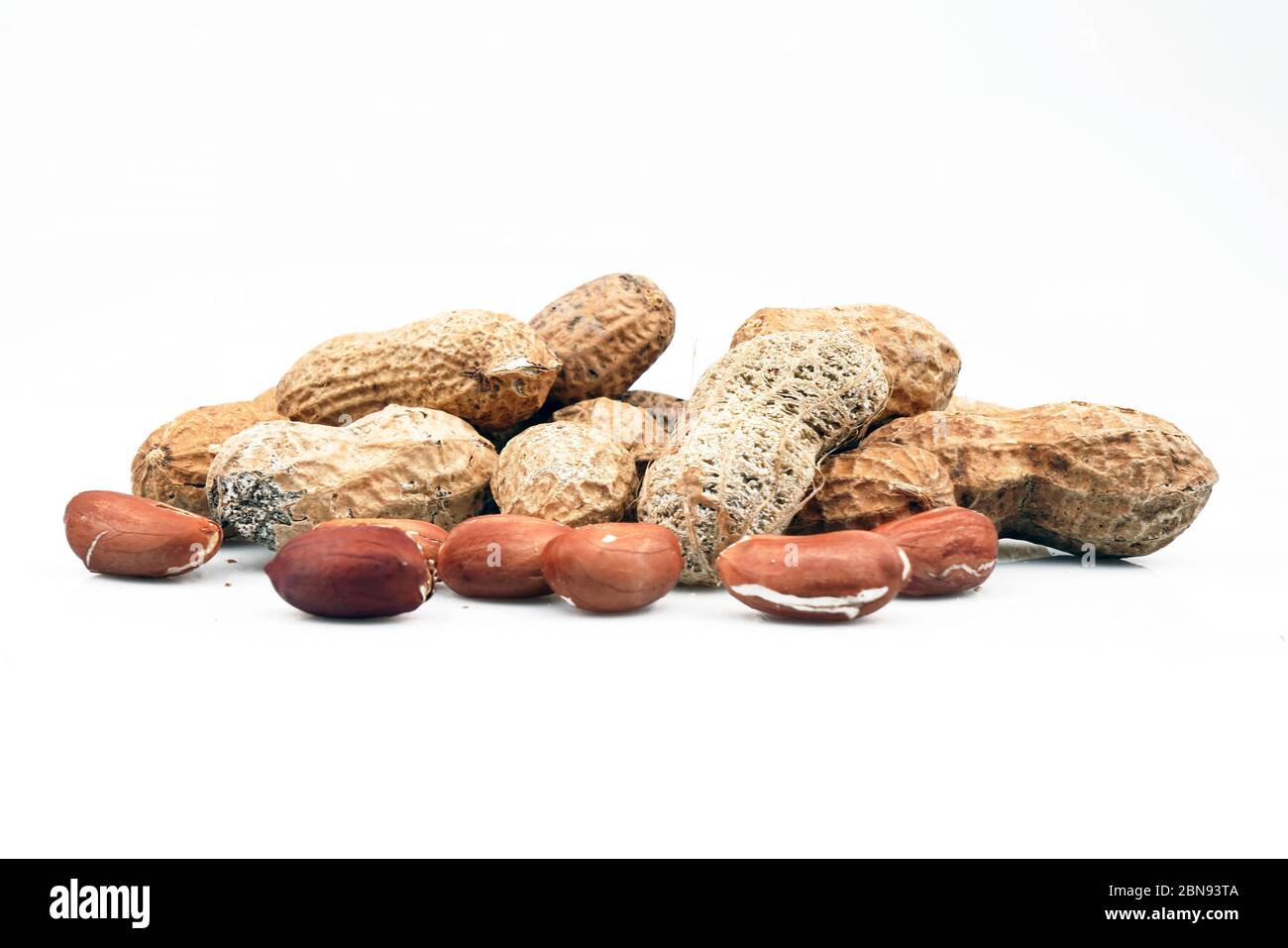 Organic and fresh Shelled and unshelled peanuts. Stock Photo