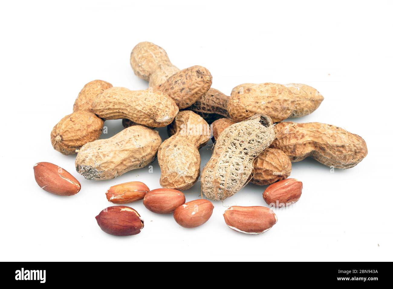 Organic and fresh Shelled and unshelled peanuts. Top view Stock Photo