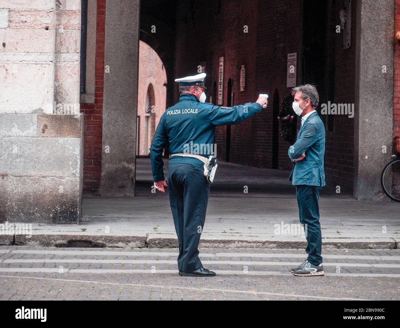 Cremona, Lombardy, Italy 13 th may 2020 Local police officer measuring adult man body