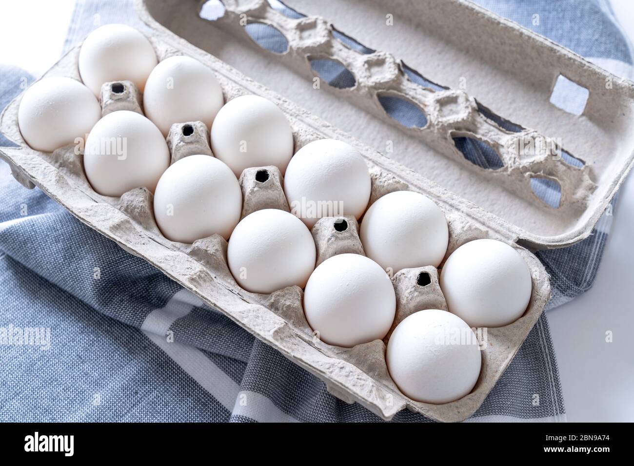 Twelve eggs in a carton package Stock Photo