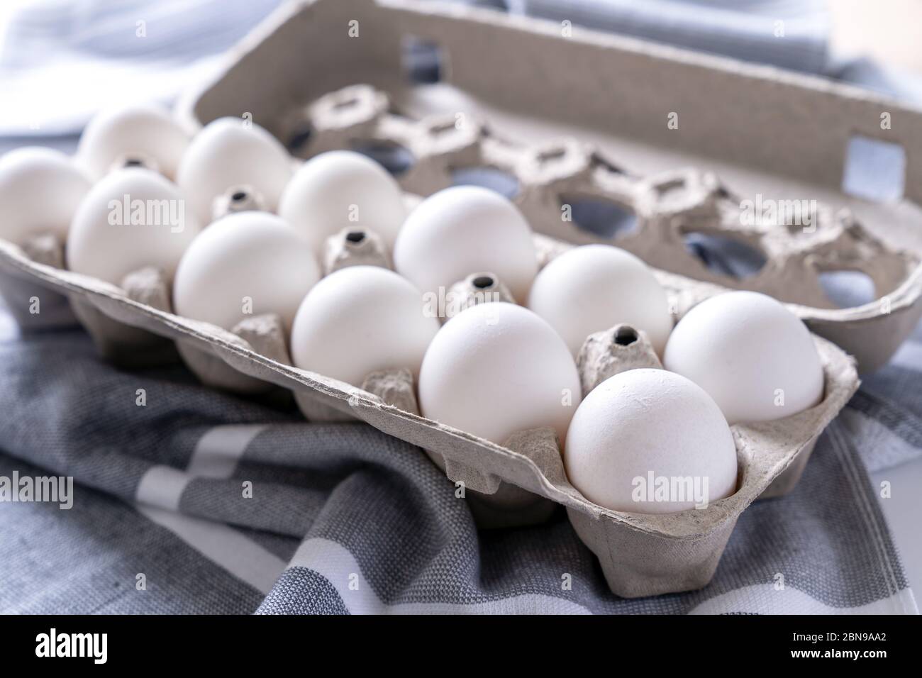 Twelve eggs in a carton package Stock Photo