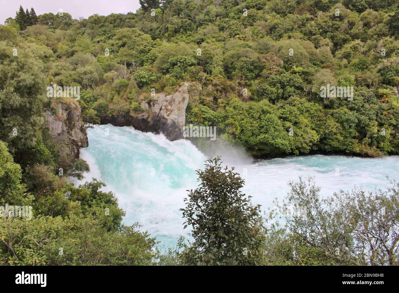 Stunning Huka Falls of Waikato River in Taupo District in Waikato Region on the North Island in New Zealand. The massive, powerfull waterfall is surro Stock Photo