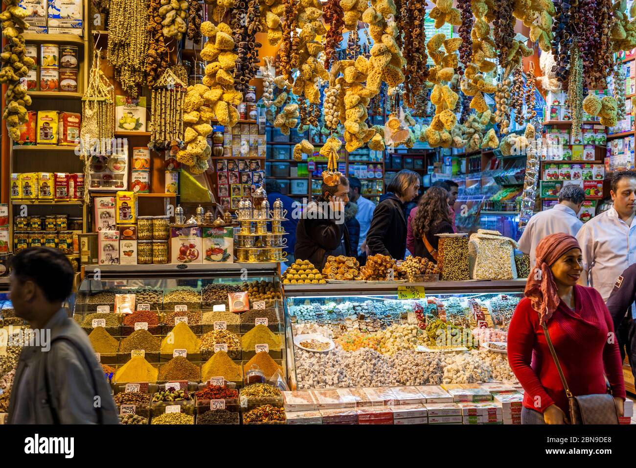 Sponges, tea and sweets in busy Turkish market stall. Bazaar in Fatih