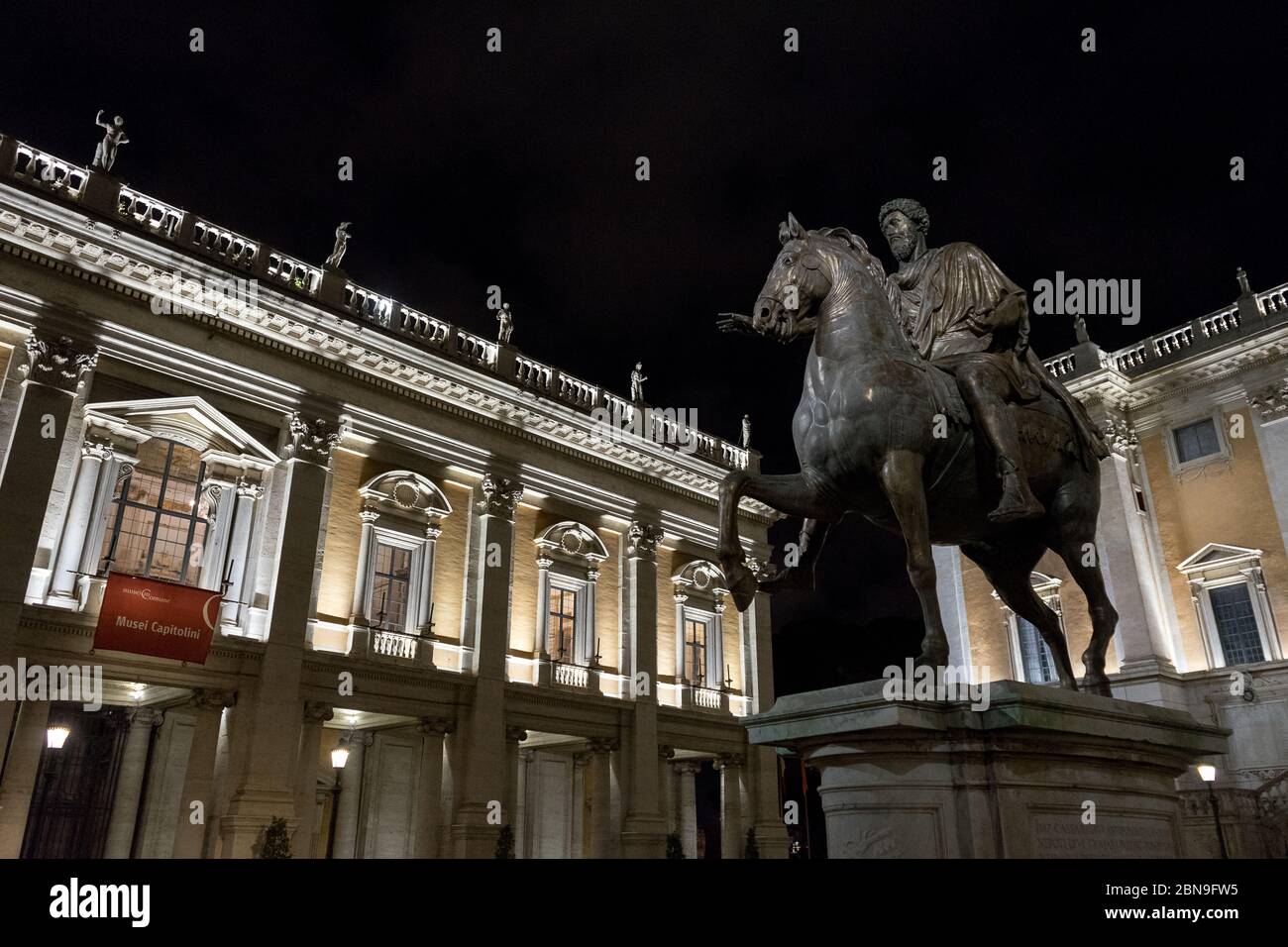 Rome, Italy: Capitol square of Rome with copy of the statue of Marcus Aurelius on the right and Capitoline museum on the left, by night. Stock Photo