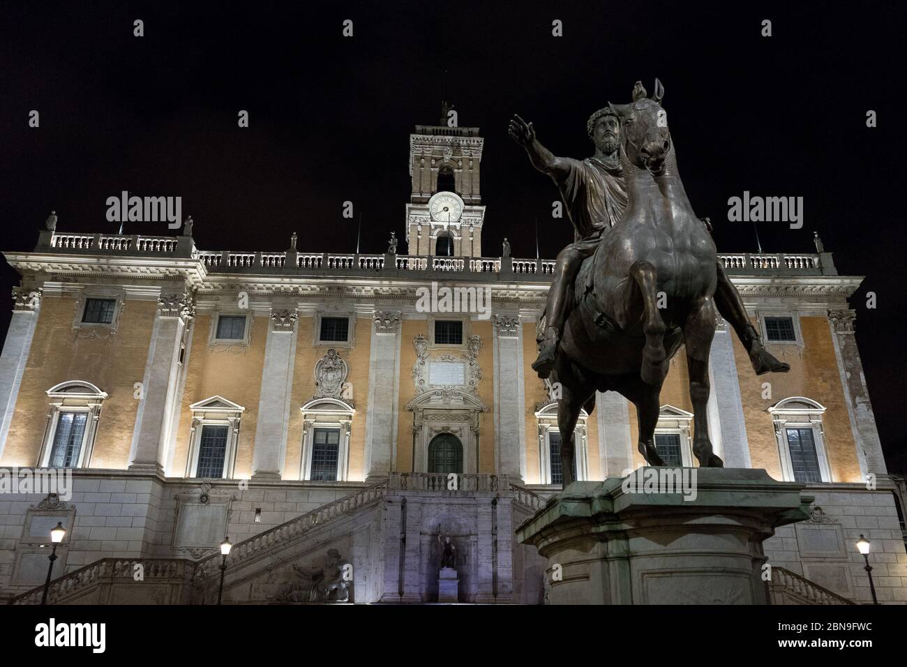 Rome, Italy: Campidoglio square of Rome with the copy of the statue of Marcus Aurelius in the close up and Palazzo Senatorio in the background Stock Photo