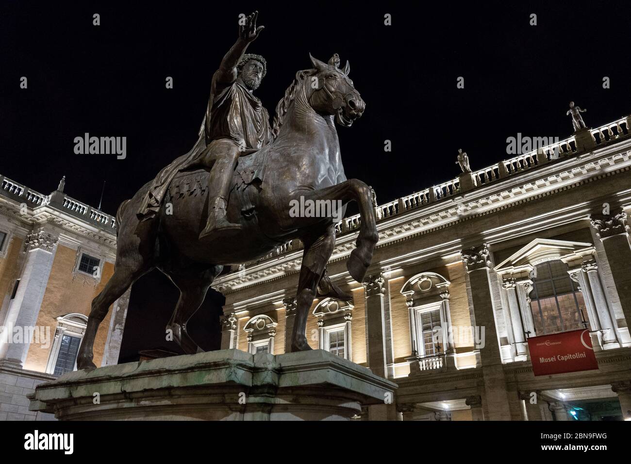 Rome, Italy: Capitol square of Rome by night with the statue of Marcus Aurelius on the left and Capitoline museum on the right. Stock Photo