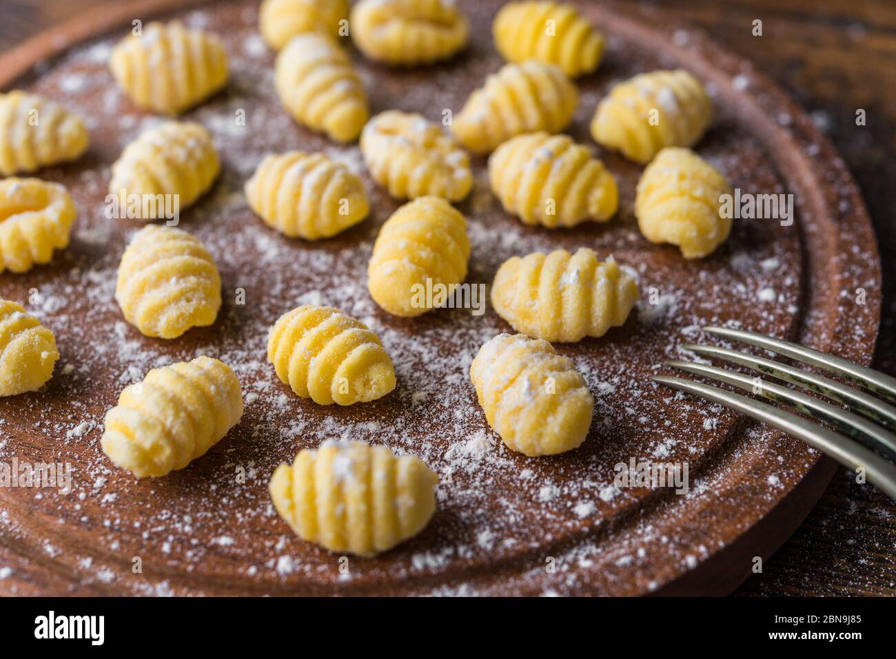 Making gnocchi, traditional Italian pasta food made of potatoes and flour. Stock Photo