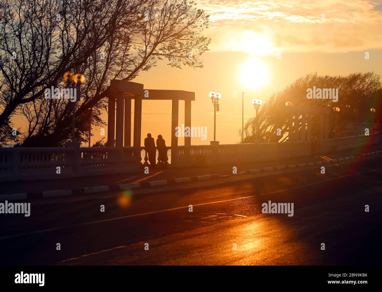 Photo of a beautiful sunset on the sea with ships Stock Photo - Alamy