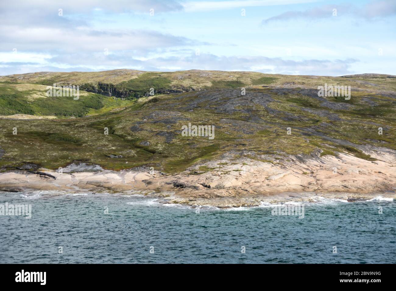 The hilly tundra shoreline on the Lower North Shore of the Gulf of St. Lawrence, Atlantic coast, near Harrington Harbour, Quebec, Canada. Stock Photo