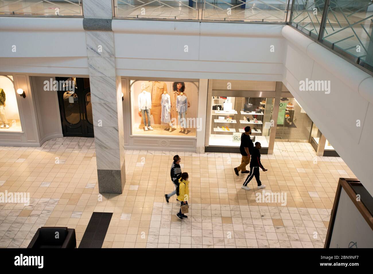 Atlanta, GA, USA. 8th May, 2020. Shoppers slowly began showing up at Atlanta  area malls as COVID-19 restrictions were lifted in Georgia.Pictured: A  handful of shoppers stroll through Lenox Mall, one of