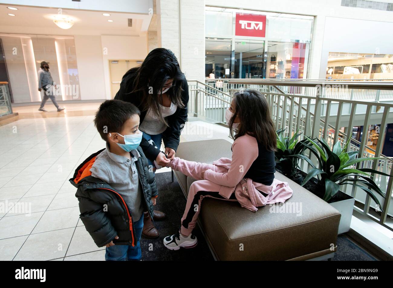 Atlanta, GA, USA. 8th May, 2020. Shoppers slowly began showing up at Atlanta  area malls as COVID-19 restrictions were lifted in Georgia.Pictured: A  handful of shoppers stroll through Lenox Mall, one of