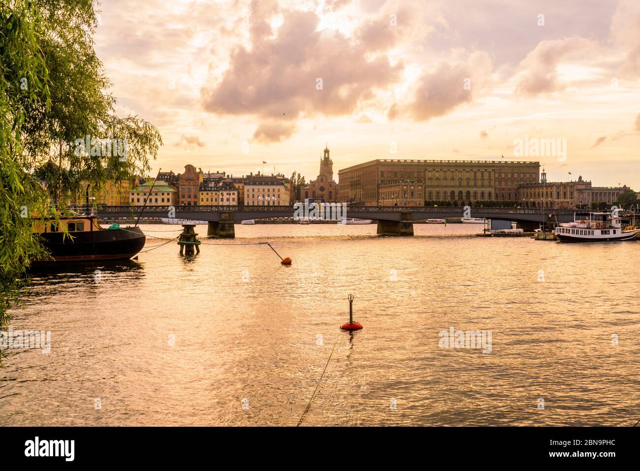 Skyline and waterfront of Gamla Stan and the royal palace at sunset Stock Photo