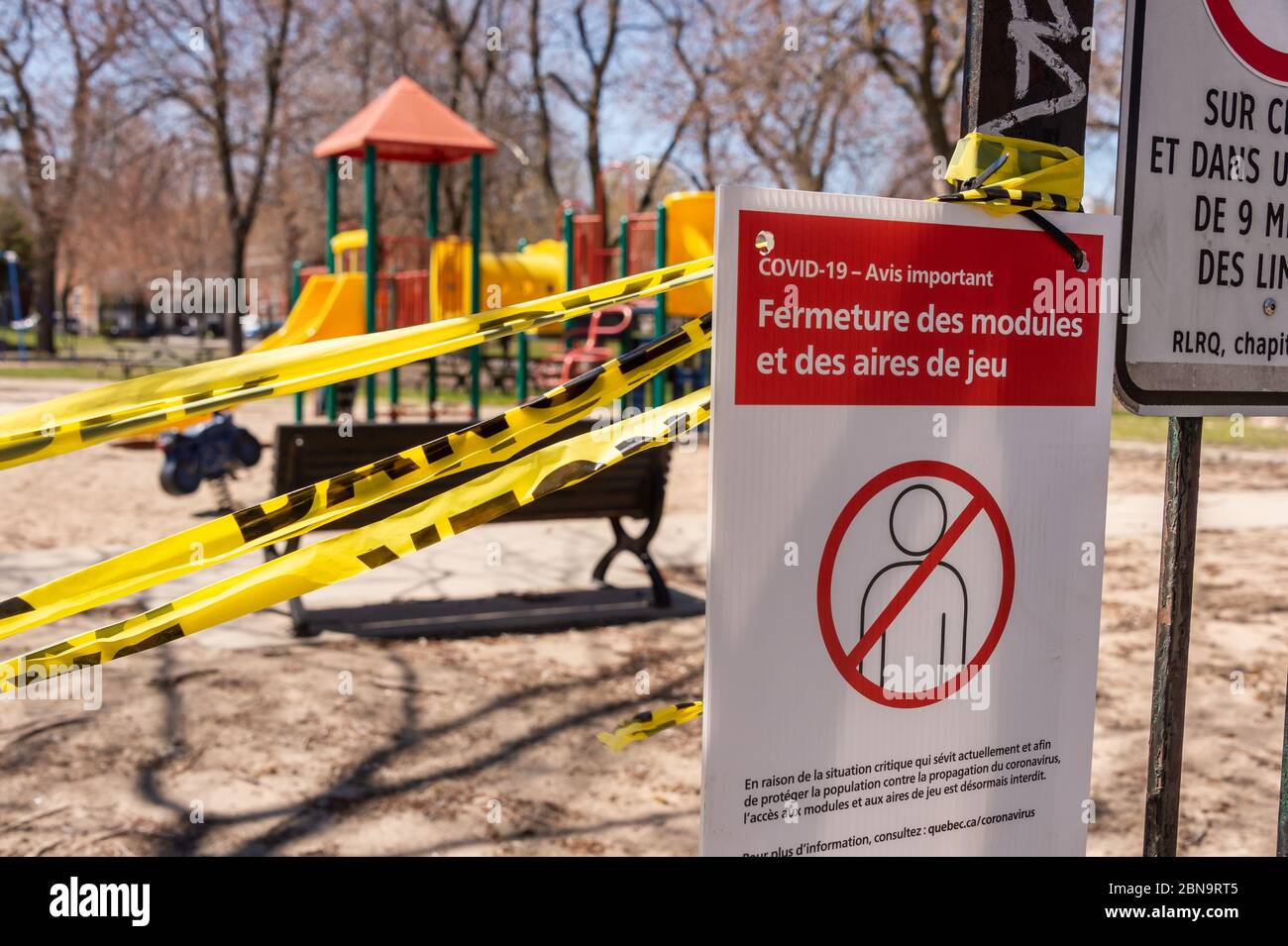Montreal, CA - 13 May 2020 : a sign alerts residents of Montreal that playgrounds are closed due to COVID-19 pandemic. Stock Photo