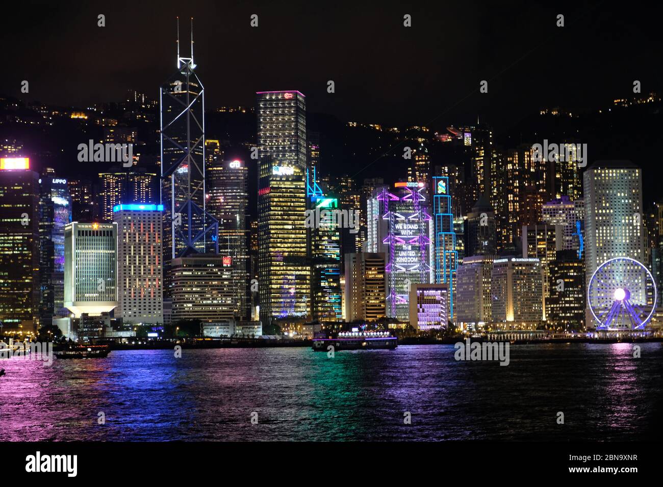 Hong Kong China - Hong Kong Island skyline at night from Kowloon side ...