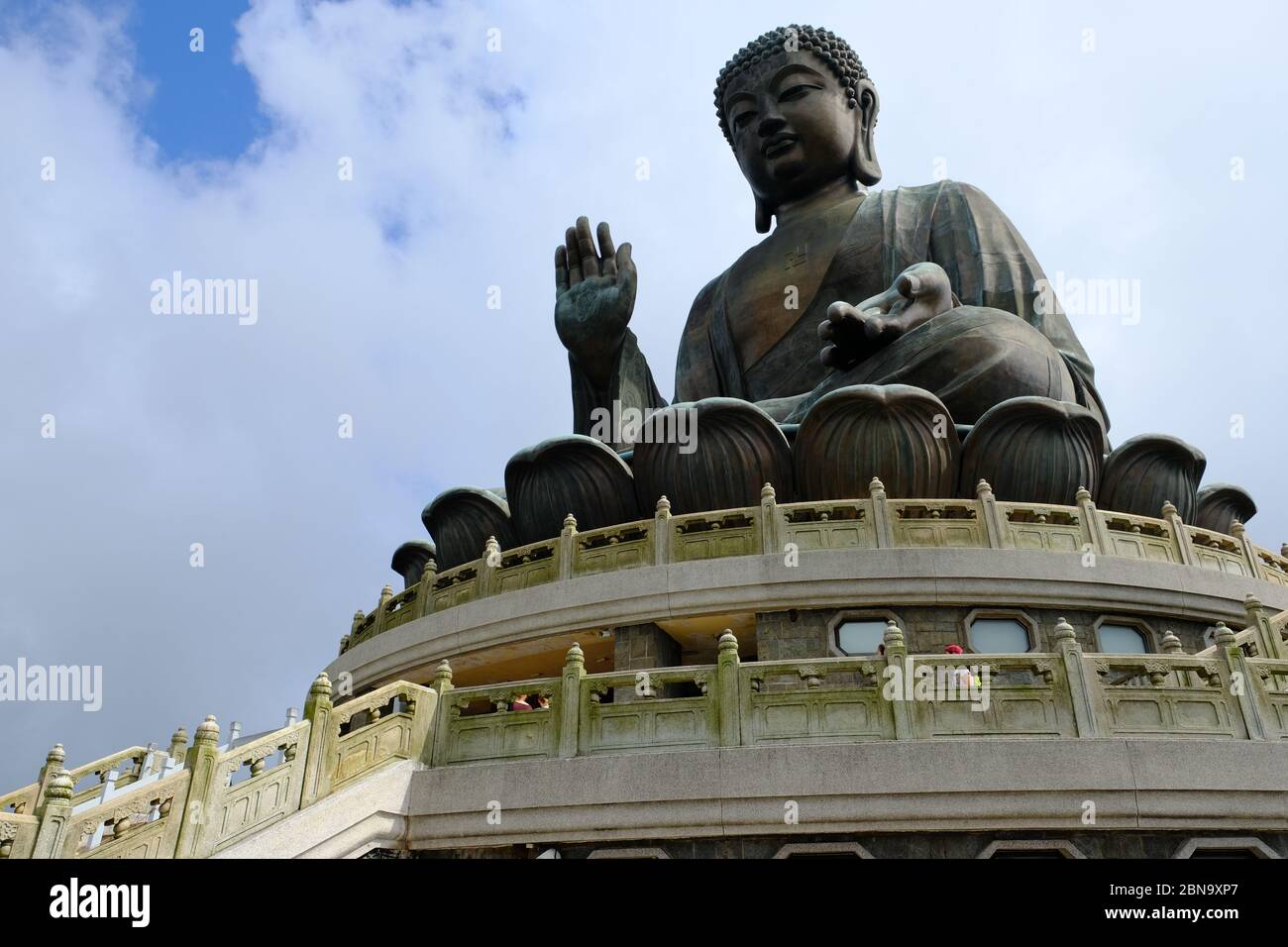 Hong Kong China - Tian Tan Buddha enthroned on a lotus on top of a three-platform altar Stock Photo