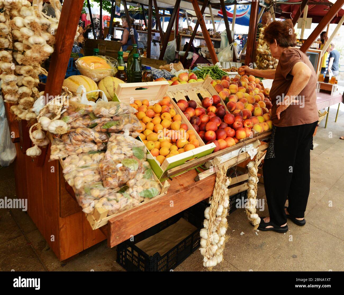 The vibrant outdoor Zadar market with stalls selling fresh fruits
