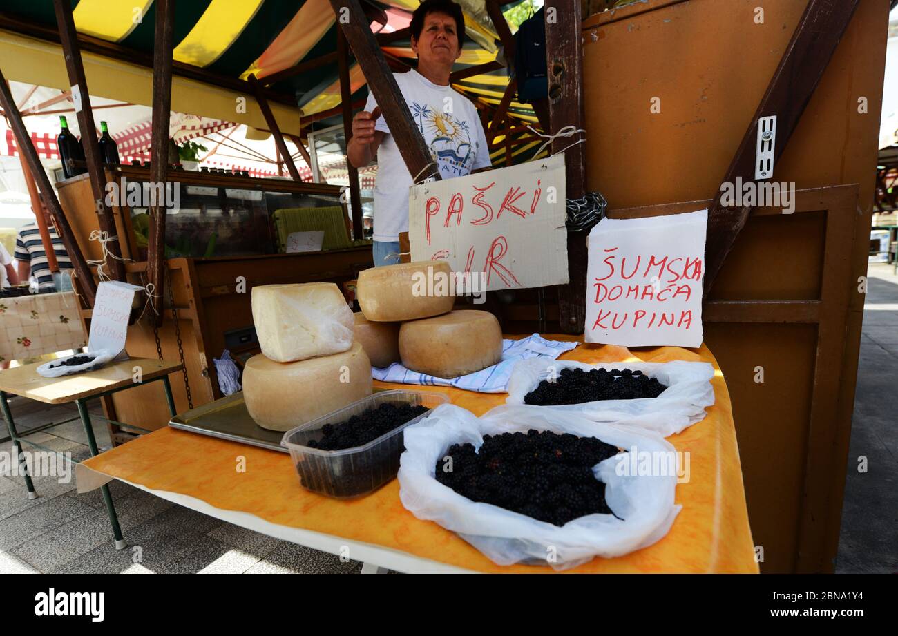 The vibrant outdoor Zadar market with stalls selling fresh fruits