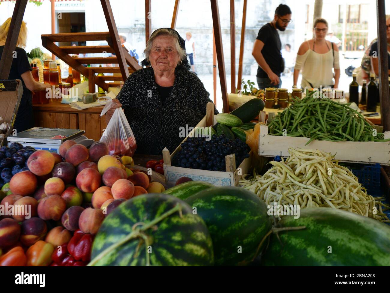 The vibrant outdoor Zadar market with stalls selling fresh fruits