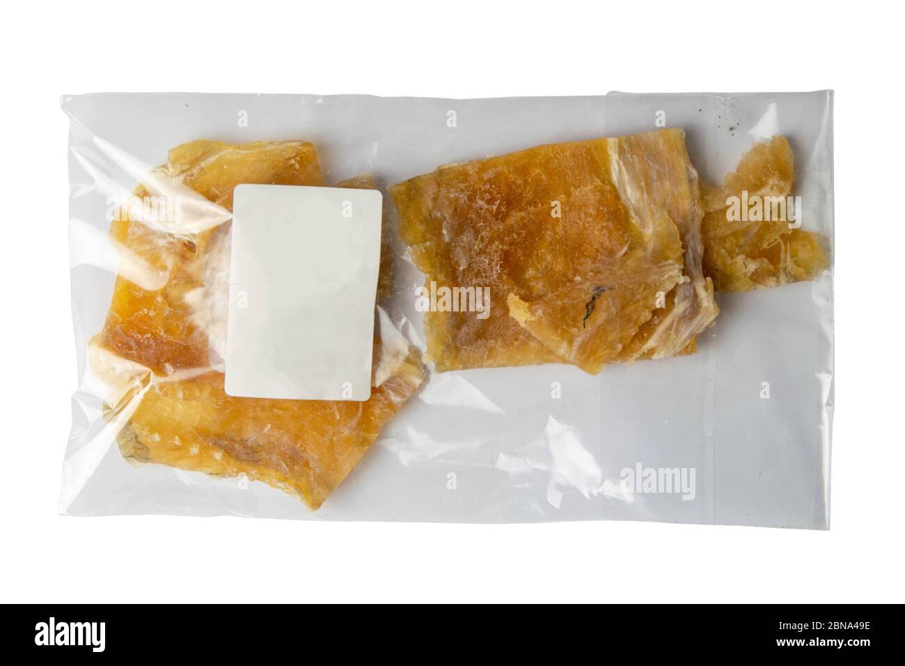 Dried cod fillet in a transparent package appetizer to beer on white ...