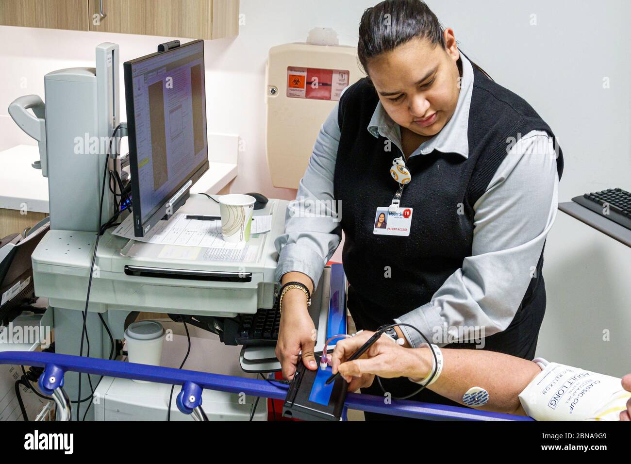 Miami Beach Florida,Mount Mt. Sinai Medical Center centre hospital,emergency room,Hispanic Latin Latino ethnic immigrant immigrants minority,woman wom Stock Photo