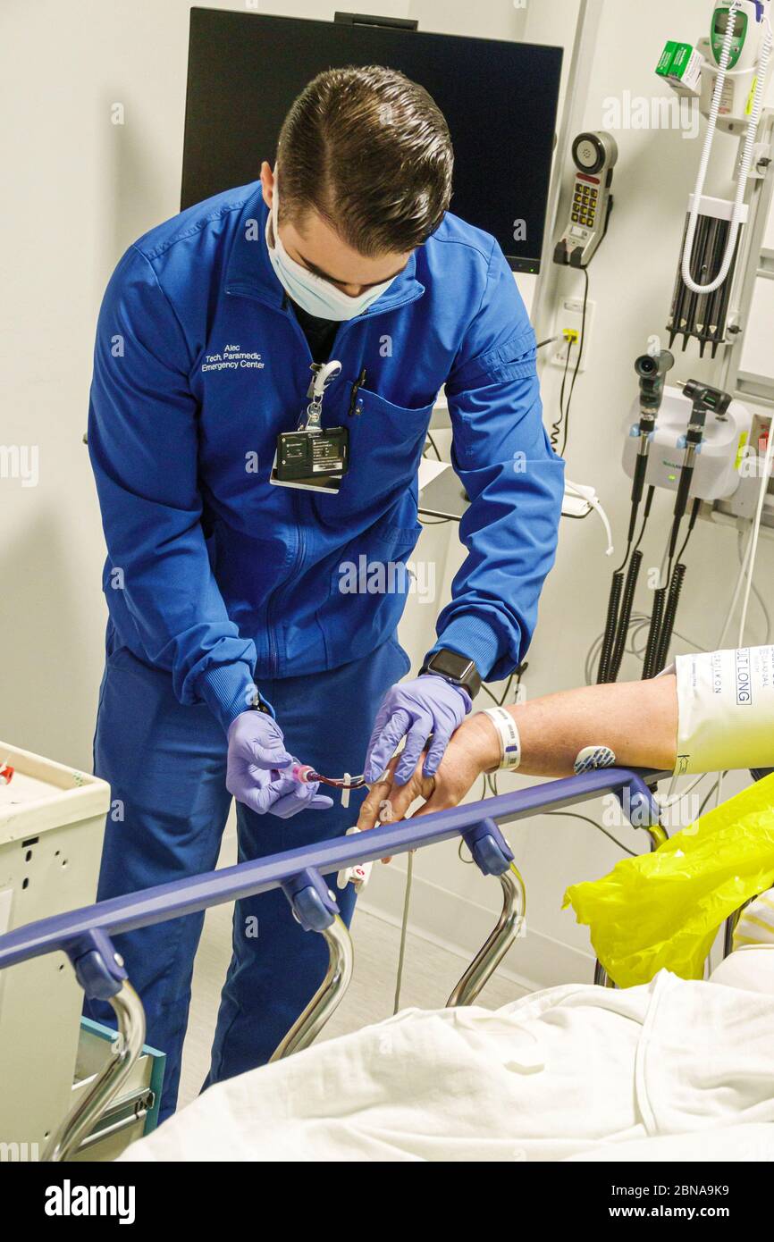 Miami Beach Florida,Mount Mt. Sinai Medical Center centre hospital,emergency room department,technician paramedic,worker employee,PPE personal protect Stock Photo