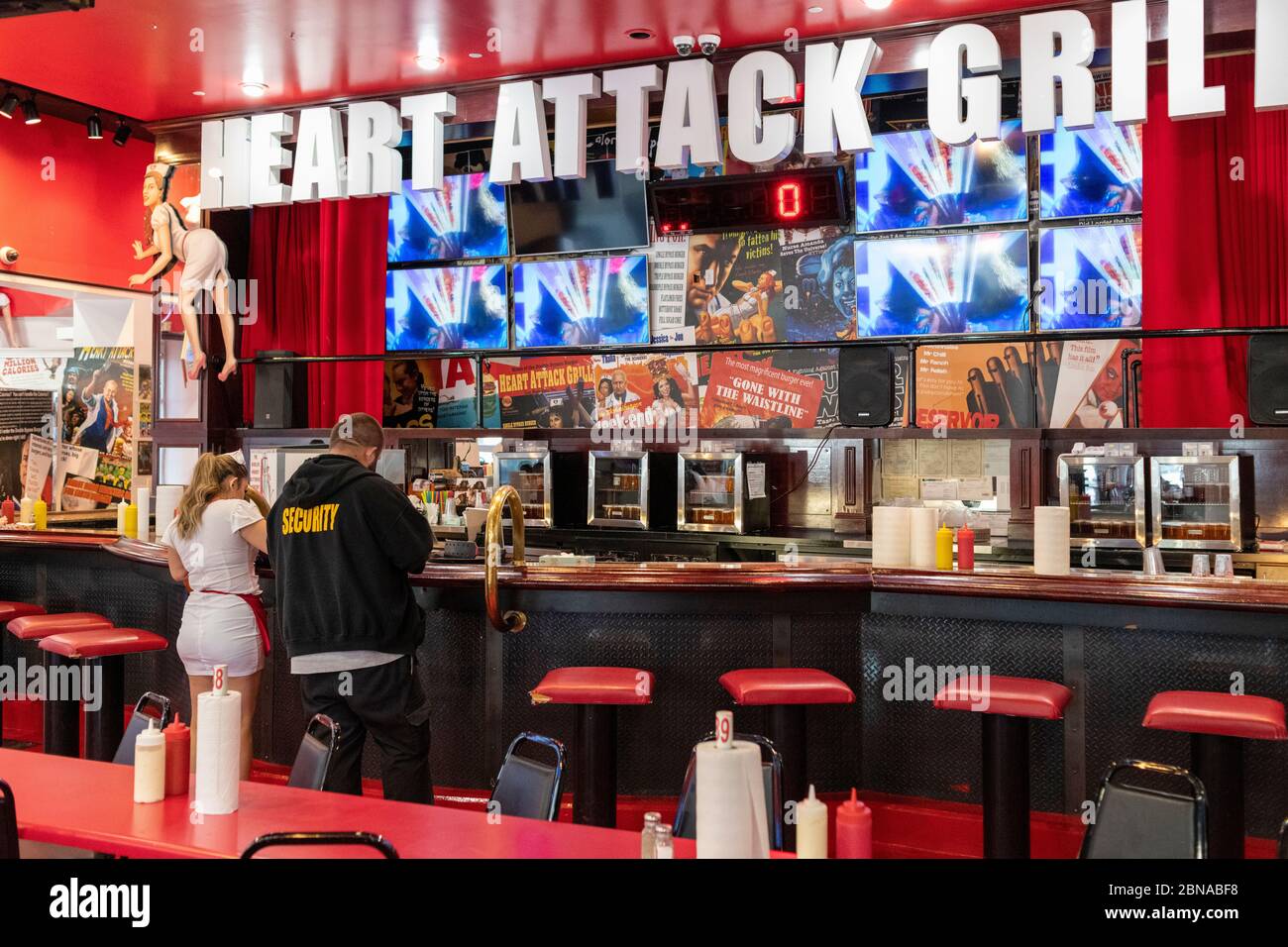 Bar and counter, with staff, at the Heart Attack Grill. Stock Photo