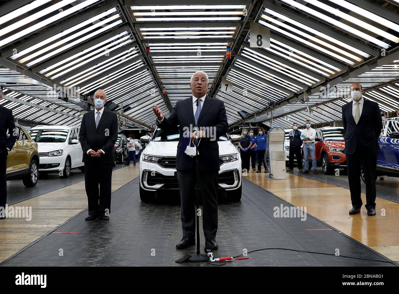 (200514) -- LISBON, May 14, 2020 (Xinhua) -- Portuguese Prime Minister Antonio Costa (C) speaks to reporters during his visit to the Volkswagen Autoeuropa car factory in Palmela, Portugal, May 13, 2020. Portuguese President Marcelo Rebelo de Sousa and Prime Minister Antonio Costa on Wednesday encouraged all industries to restart under strict conditions amid the COVID-19 pandemic, Lusa News Agency reported. After their joint visit to automotive assembly plant Autoeuropa, the two leaders expressed their confidence in the resumption of production for the car producer. (Photo by Pedro Fiuza/Xin Stock Photo