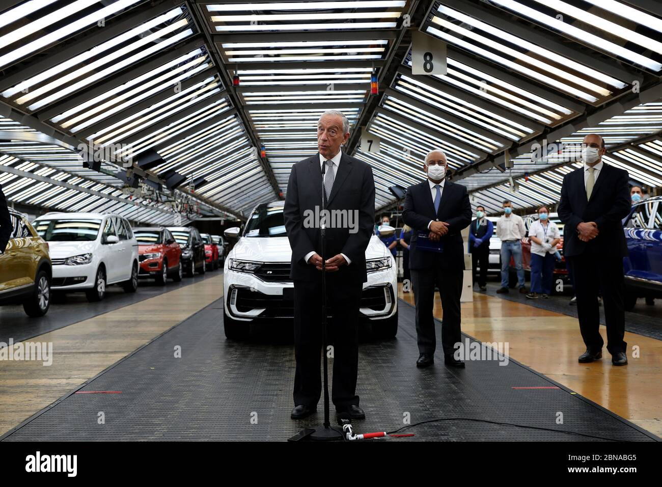 (200514) -- LISBON, May 14, 2020 (Xinhua) -- Portuguese President Marcelo Rebelo de Sousa (1st L) speaks to reporters during his visit to the Volkswagen Autoeuropa car factory in Palmela, Portugal, May 13, 2020. Portuguese President Marcelo Rebelo de Sousa and Prime Minister Antonio Costa on Wednesday encouraged all industries to restart under strict conditions amid the COVID-19 pandemic, Lusa News Agency reported. After their joint visit to automotive assembly plant Autoeuropa, the two leaders expressed their confidence in the resumption of production for the car producer. (Photo by Pedro Stock Photo
