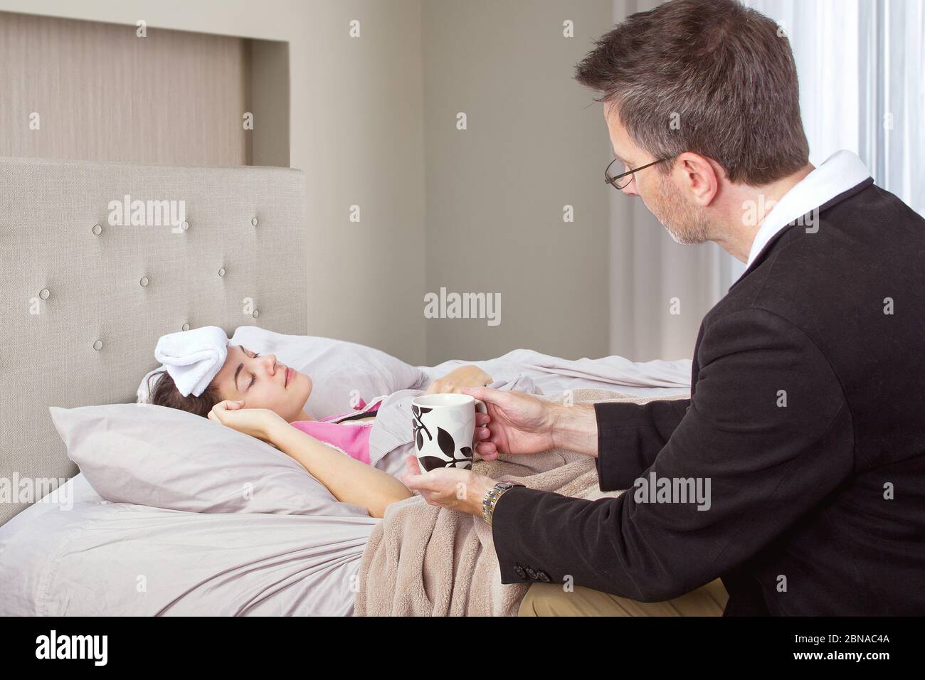 Worried Parent Sick Child High Resolution Stock Photography and Images